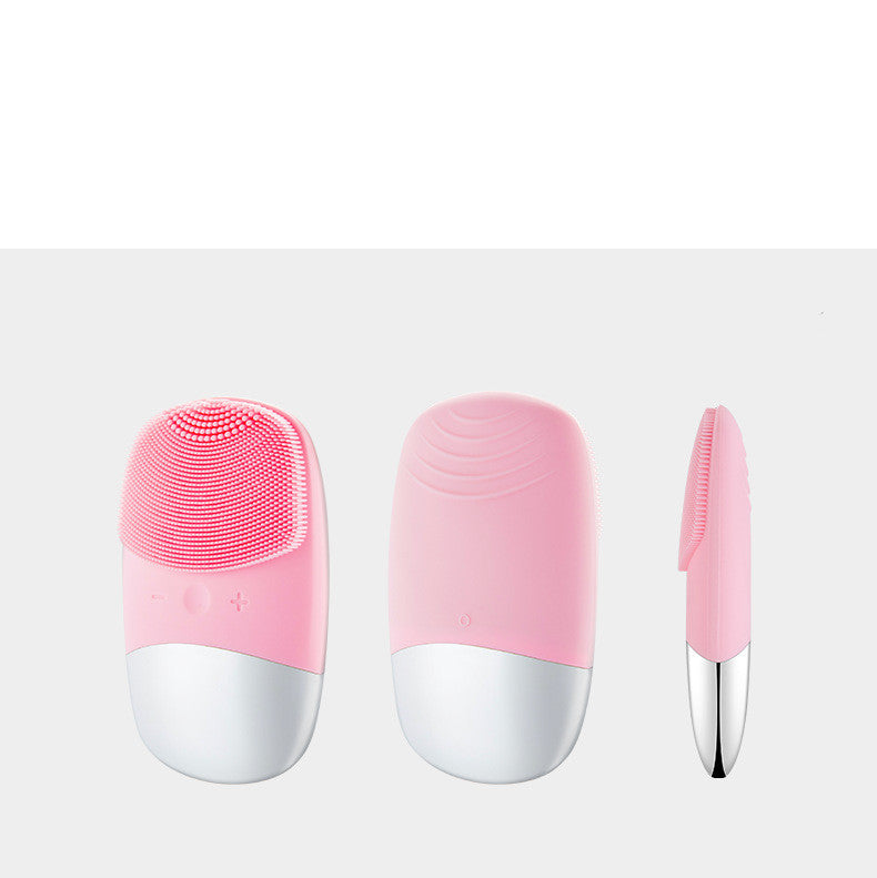 Velvura sonic silicone facial cleansing brush showing front, back and side views in pink